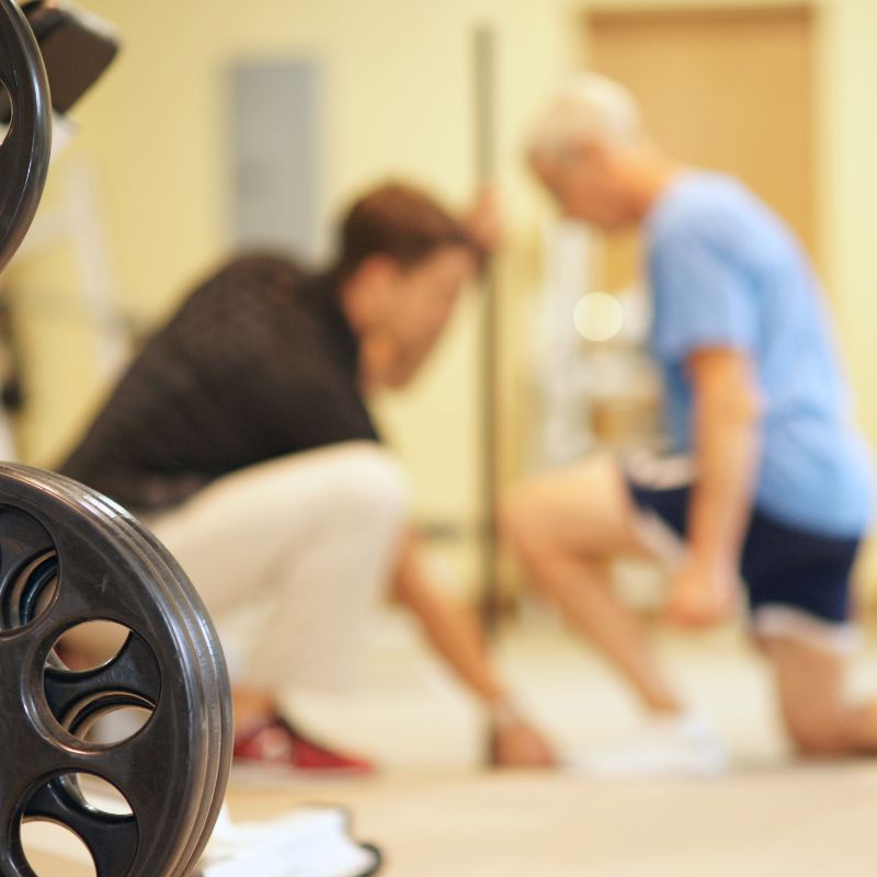 Exercise physiologist works with client on fitness assessment training